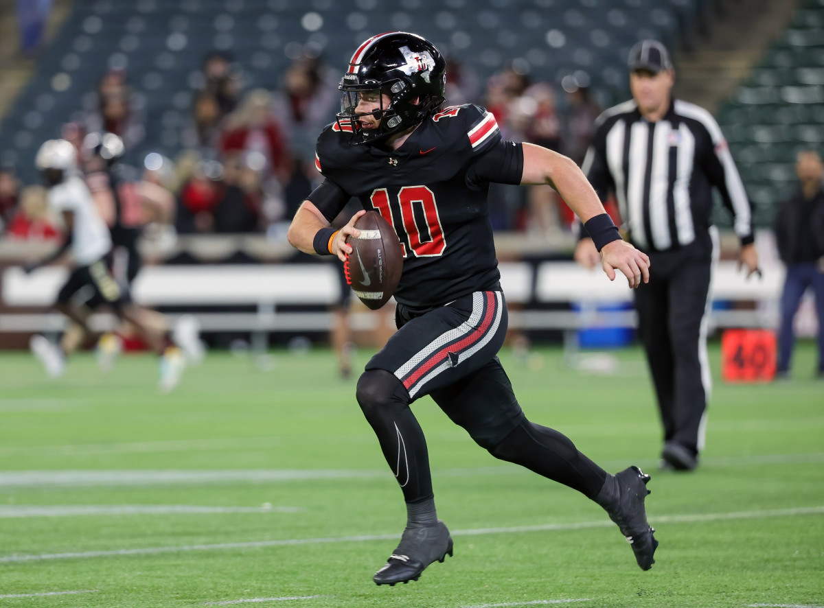 Senior Alexander Franklin rolls out of the pocket and surveys the field during a playoff loss to South Oak Cliff. 